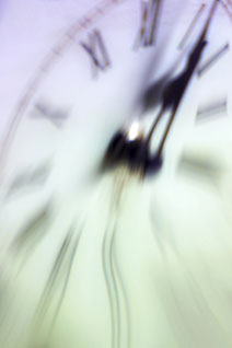 An out of focus clock shows how time to run your business can be difficult to manage